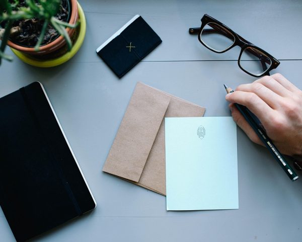 hand, man, watch, work, desk, workspace, people, business, male, person, businessman, letter, envelope, pen, writing, notebooks, business, business, letter, letter, letter, letter, letter, envelope, writing